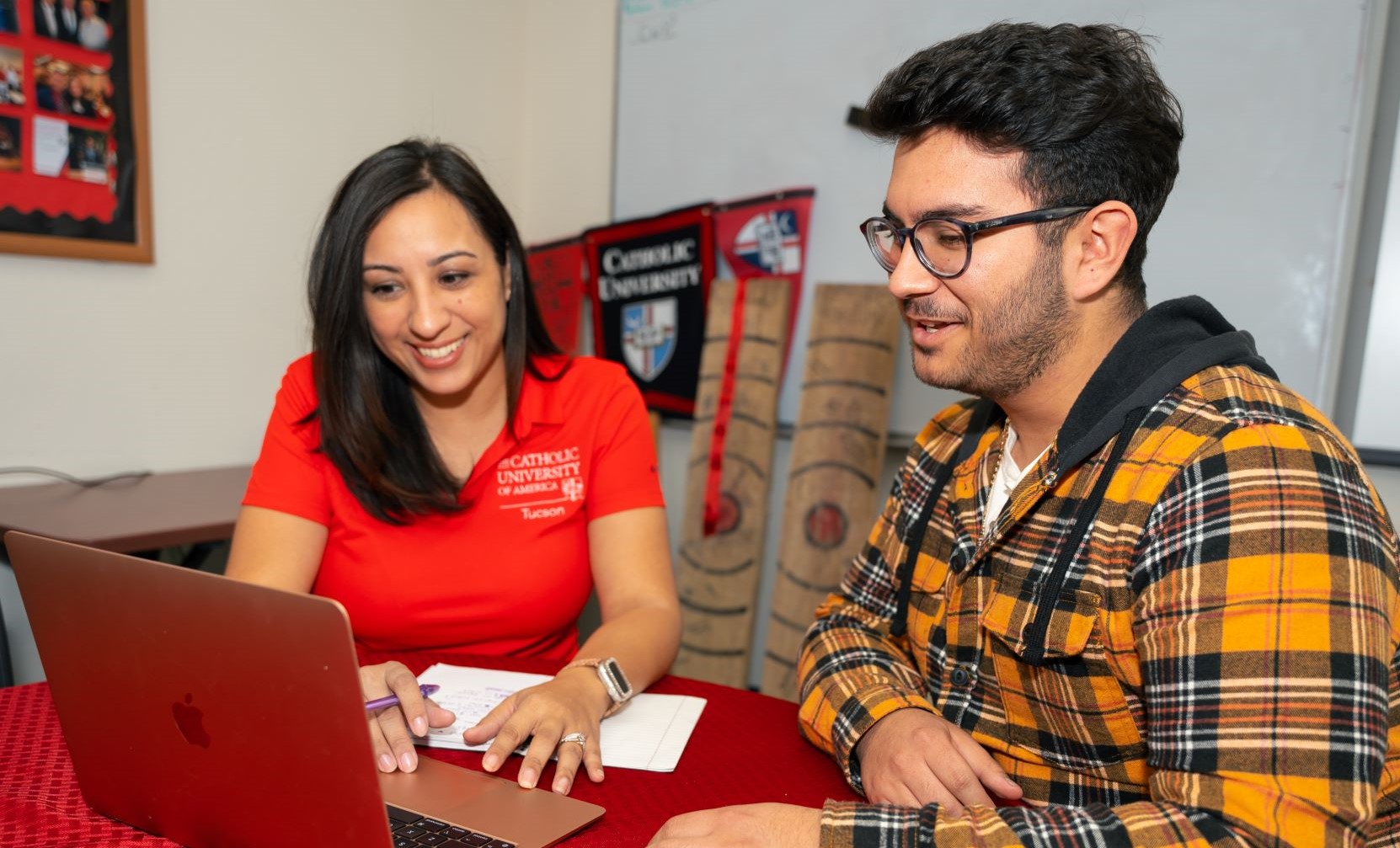 advisor working with a student