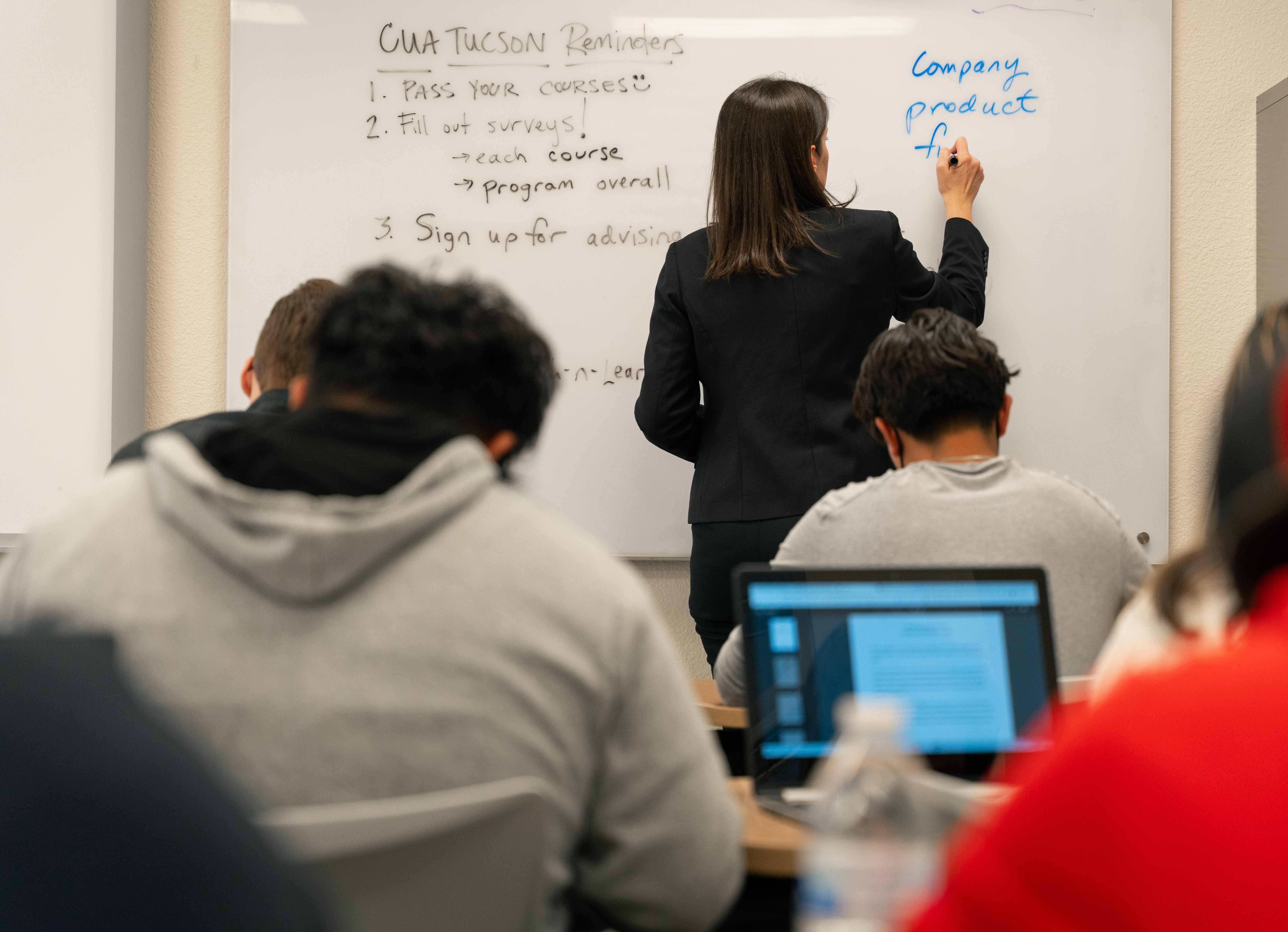 Female teacher at front of classroom